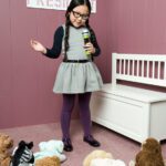 iStock_000018683766Small_grab an audience_little_girl_speaking_to_dolls